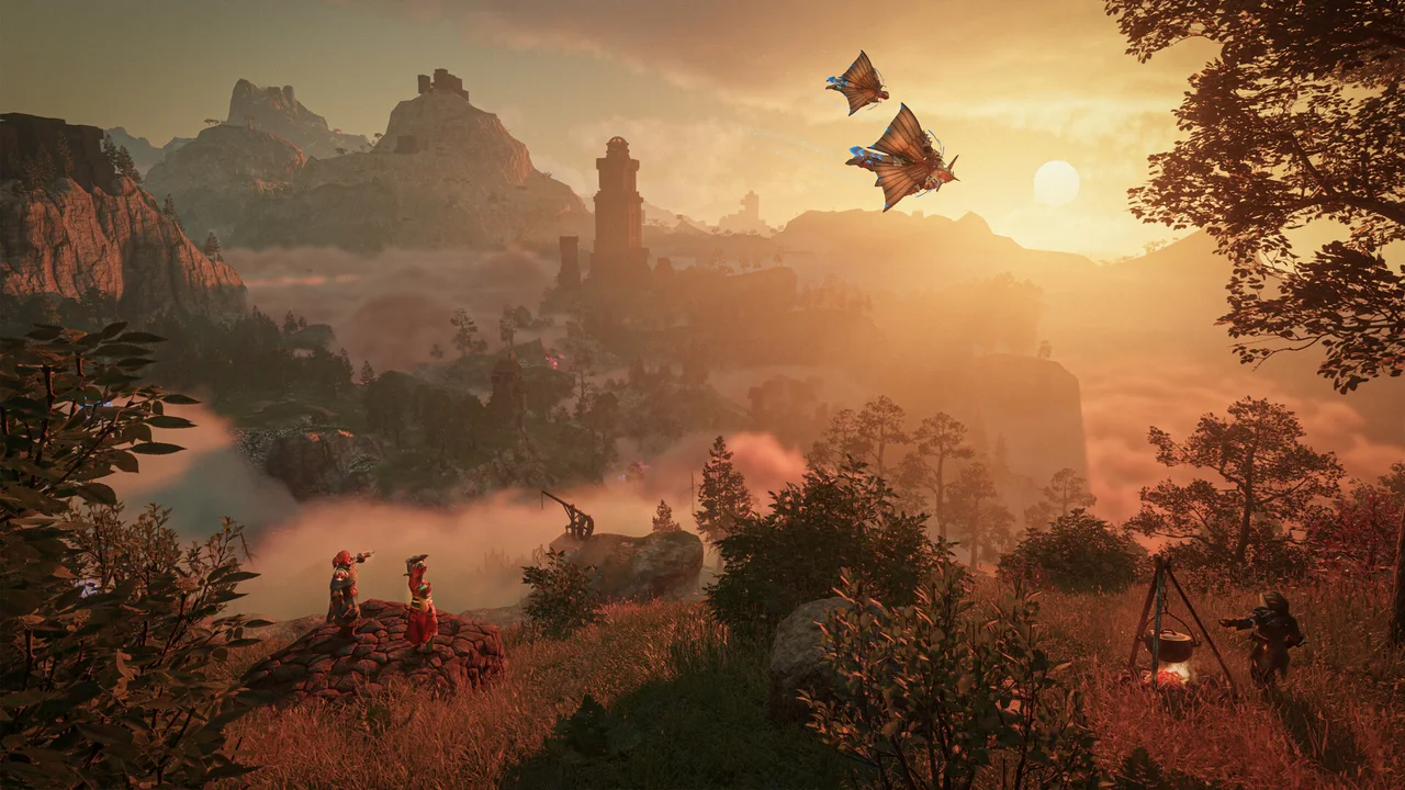 An orange sunset over Embervale’s forested valley and distant ruins